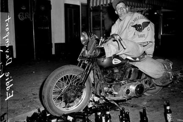 Biker Eddie Davenport amongst empty bottles